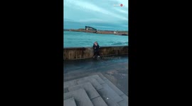 Woman learns that her feet aren't quick enough to escape the might of raging waves
