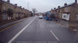 Taxi plays a game of chicken against a triple axle coach forcing the coach to emergency stop in its own lane. No Captions