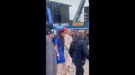 Woman at Cheltenham Festival steals the show with Domino's-themed hat
