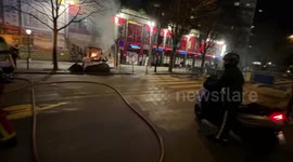 Firefighters put out a fire in bobcat as massive protests against the retirement bill in France, take place, Paris, France