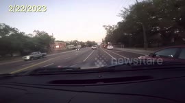 Hit and Run: Road Incident Between a Vehicle and a Red Car Results in Minor Damage