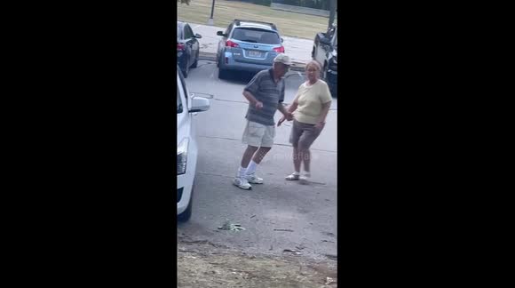 Older couple sharing a dance at a local park that had a live band playing