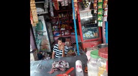 Indian Man pan , gatka , cooldrink , milk ,biscuit , black tea & milk tea sell on roadside stall