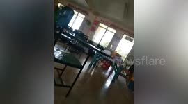 Pupils take cover as soldiers clash with communist rebels near school in the Philippines