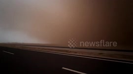 Orange weather warning for an orange sky: Sand storm engulfs Inner Mongolia