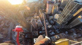 Incredible, heart-pounding POV clip shows daredevil FREE CLIMBING 1,500ft-crane in Manhattan