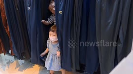 Kids playing hide and seek at sports departmental store in Malaysia