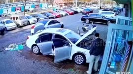 Man narrowly avoids injury as window plunges from building in China