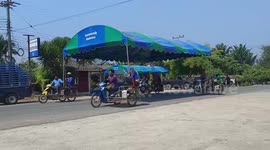 Clever villagers mount party tent on motorcycles to easily transport it