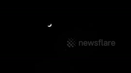 The crescent moon is seen with the planet Venus below creating a spectacular site in the night sky.