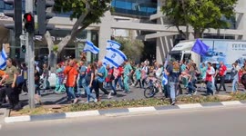 Procession of protesters walking through Tel Aviv, Israel