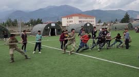 Soldiers Play Tug-Of-War With Children In Affected Areas In Turkey