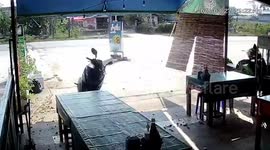 Powerful dust devil swirls outside restaurant in Thailand