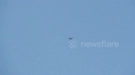 Palestinians run from tear gas canisters fired by Israeli forces near the fence east of Gaza city following a rally marking the 47th anniversary of Land Day