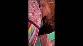 Sweetie, you're asleep in a box! Mom is tickled by the sight of her 'boxed up' daughter