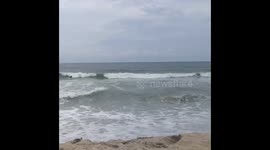 Ocean shore at outset of storm.