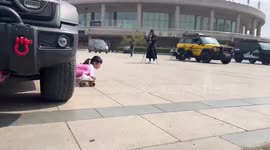Chinese girl performs incredible roller skating splits under 12 parked vehicles