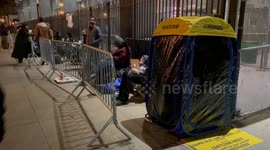 Journalists wait overnight for admission to Manhattan Criminal Courthouse ahead of Trump arraignment