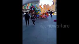 Angry vendor ignites rival's hydrogen-filled balloons in heated dispute in China