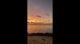 Ever changing colours of the sunset with the moon in the sky