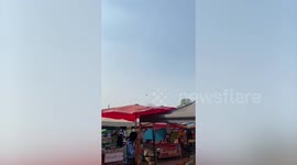 Umbrella floats like UFO during high winds in Thailand