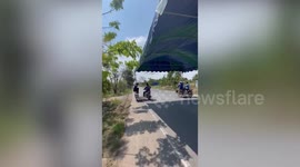 Clever villagers mount party tent on motorcycles to easily transport it