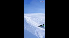 Rider loses jet ski in a cloud of snow following a failed jump attempt