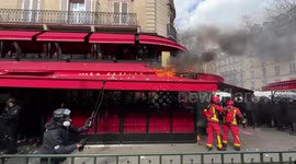 Protesters set restaurant on fire in Paris