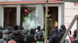 Bank front smashed by pension reform rioters in Paris
