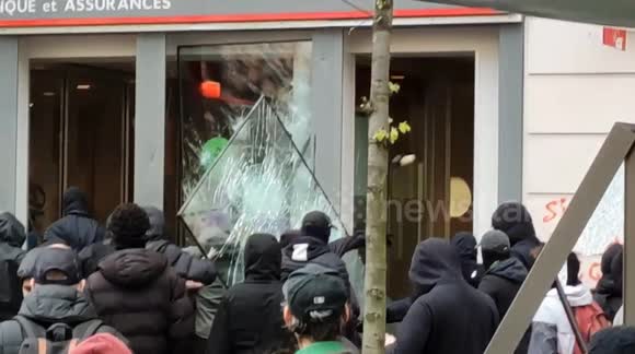 Bank front smashed by pension reform rioters in Paris