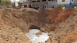 Israeli-Palestinian tension: Locals look at crater left by air strikes on Gaza after rockets fired into Israel