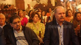 Palestinian Christians attend an Orthodox Palm Sunday, at the Church of Saint Porphyrius