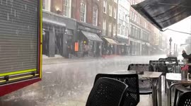 Sudden heavy rain slams London’’s Soho