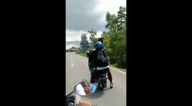 Motorbike stunt goes wrong: friend takes a tumble in Kendari, Indonesia