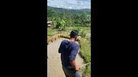 Caught on camera: boy escapes as neighbor falls into mud in Sukabumi, West Java