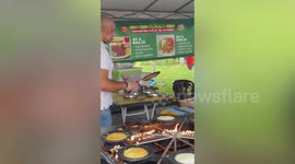 Vin Diesel's lookalike amuses customers cooking desserts at stall in Malaysia