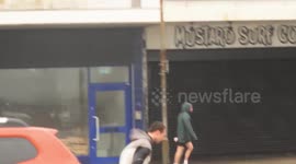 Storm Noa gets the best of pedestrians on a busy West Country road