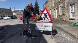 My road's potholes got so bad I set up a crazy golf course on my street