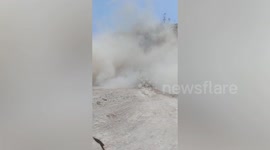 Excavator buried under landslide at quarry in Thailand