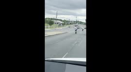Two unsafe motorcycle drivers in Atlanta, GA doing wheelies on a busy road and holding up traffic behind them