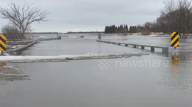 Minnesota motorist records as they drive through submerged roads as floods strike state