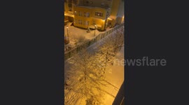 Unexpected Snow Shower! Dad and Child get covered in snow while playing with a trees in St. Petersburg, Russia