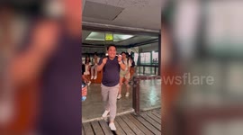 Tourists trips over while walking on viewing deck