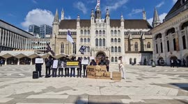 Hong Kongers protest visit by Treasury Secretary Christopher Hui at London's Guildhall