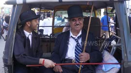 Hundreds of Charlie Chaplin impersonators march through Indian town to mark his birthday