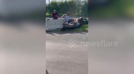 Shocking moment Grand National racegoer was left injured after being hit by two stampeding horses