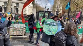 Huge group of Extinction Rebellion Red Rebels march in Westminster