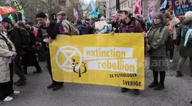 Climate protester march down White Hall to Parliament Square