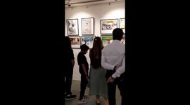 Visitors takes a look of a Photo exibition by Working News Cameraman association,More than 250 photographs exhibited by Photo Journalist showcasing thier work.