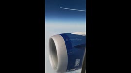 Airplane Flying Parallel a Boeing 787 with Rolls Royce engine